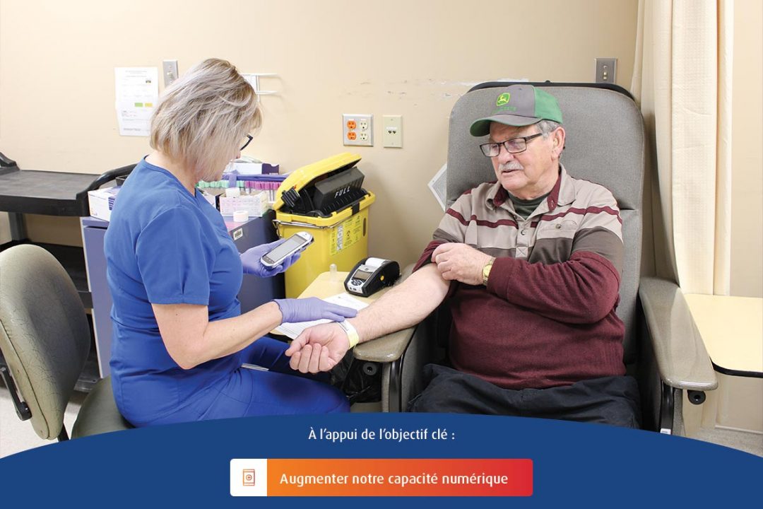 A registered nurse at Health Sciences North displays a MobiLab